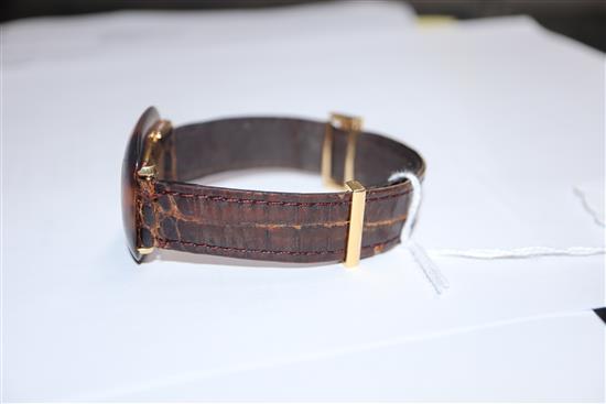 A ladys Boucheron 18ct and tortoiseshell manual wind dress wrist watch, on leather strap with 18ct buckle.